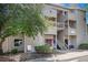 Inviting multi-level apartment building with a private entrance and designated handicapped parking space at 3600 S Pierce St # 2-201, Lakewood, CO 80235