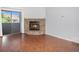 Spacious living room featuring a stone fireplace and sliding glass doors to the balcony at 3600 S Pierce St # 2-201, Lakewood, CO 80235