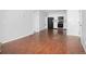 Open-concept room featuring wood floors and an easy flow to the kitchen at 3600 S Pierce St # 2-201, Lakewood, CO 80235