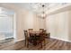 Cozy dining area featuring a table, chairs, and a stylish lighting fixture at 8779 S Kipling Way # 204, Littleton, CO 80127