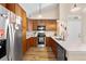 Modern kitchen with stainless steel appliances, granite countertops, and ample cabinet space at 8779 S Kipling Way # 204, Littleton, CO 80127