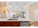 The open-concept kitchen flows into the living area, perfect for entertaining at 8779 S Kipling Way # 204, Littleton, CO 80127