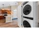 Conveniently located laundry closet with modern stacked washer and dryer at 8779 S Kipling Way # 204, Littleton, CO 80127