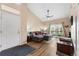 Spacious living room with sliding door to the balcony, comfortable seating and stylish décor at 8779 S Kipling Way # 204, Littleton, CO 80127