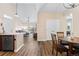 Inviting living space that seamlessly blends the kitchen, dining, and living areas at 8779 S Kipling Way # 204, Littleton, CO 80127