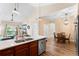 Open floor plan showcases the updated kitchen, living and dining areas at 8779 S Kipling Way # 204, Littleton, CO 80127