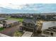 Aerial view of home showing the neighborhood with a field and playground nearby at 2303 Monte Vista St, Fort Lupton, CO 80621