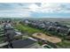 Aerial view of homes in a Gathering-friendly neighborhood near playground and green space at 2303 Monte Vista St, Fort Lupton, CO 80621