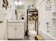 Clean bathroom with vanity, toilet, and bathtub with shower at 2303 Monte Vista St, Fort Lupton, CO 80621