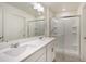 Well-lit bathroom featuring a double vanity with plenty of counter space and walk-in shower at 2303 Monte Vista St, Fort Lupton, CO 80621