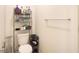 Well-organized half-bathroom with storage racks and towel bar at 2303 Monte Vista St, Fort Lupton, CO 80621