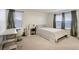 Bright bedroom featuring neutral décor, desk area, and plush carpet at 2303 Monte Vista St, Fort Lupton, CO 80621