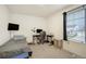 Cozy bedroom with desk area, TV and a comfortable bed at 2303 Monte Vista St, Fort Lupton, CO 80621