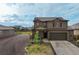 Charming two-story home featuring a two-car garage, quaint front porch, and landscaped front yard at 2303 Monte Vista St, Fort Lupton, CO 80621