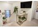 Upstairs hallway featuring decoratively styled console table and mounted television at 2303 Monte Vista St, Fort Lupton, CO 80621