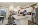 Open kitchen with granite countertops, stainless appliances and backyard views at 2303 Monte Vista St, Fort Lupton, CO 80621
