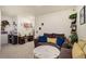 Cozy living room with plush seating, decor, and ample space for relaxation at 2303 Monte Vista St, Fort Lupton, CO 80621
