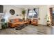 Cozy living room with hardwood floors, stylish furniture, and abundant natural light at 2303 Monte Vista St, Fort Lupton, CO 80621