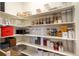 Walk-in pantry with custom shelving and plenty of storage space at 2303 Monte Vista St, Fort Lupton, CO 80621