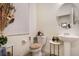 Stylish half bath with a pedestal sink and decorative accents at 2303 Monte Vista St, Fort Lupton, CO 80621