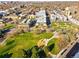 Aerial view of a vibrant community with modern architecture, parks, and tree-lined streets in an urban setting at 1950 N Logan St # 1109, Denver, CO 80203