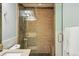 Modern bathroom features a glass enclosed shower, neutral tile, and contemporary fixtures at 1950 N Logan St # 1109, Denver, CO 80203