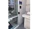 Access and security features at the building's exterior glass door entrance at 1950 N Logan St # 1109, Denver, CO 80203