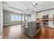 Bright, updated kitchen with breakfast bar and stainless appliances in a modern, open concept floorplan at 1950 N Logan St # 1109, Denver, CO 80203