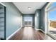 Spacious living room with hardwood floors and access to the balcony with city view at 1950 N Logan St # 1109, Denver, CO 80203