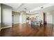 Spacious living room featuring hardwood floors, neutral walls, and an open layout leading to a modern kitchen at 1950 N Logan St # 1109, Denver, CO 80203