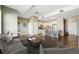 Open floor plan showcasing modern living area, kitchen with breakfast bar, and hardwood floors at 1950 N Logan St # 1109, Denver, CO 80203