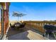 Outdoor dining on roof deck with shade umbrella, stone balustrade, and city views at 1950 N Logan St # 1109, Denver, CO 80203