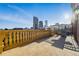 Expansive roof deck featuring a city view, balustrade and sunny exposure at 1950 N Logan St # 1109, Denver, CO 80203