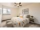 Stylishly furnished bedroom with modern decor, soft bedding, and a bright window for a comfortable retreat at 5995 W Hampden Ave # 8C, Denver, CO 80227