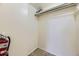 Storage closet with built in shelf, vinyl flooring, and a fire extinguisher at 5995 W Hampden Ave # 8C, Denver, CO 80227