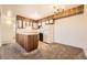 Charming kitchen features wooden cabinets and a dining area, creating a welcoming space for cooking and dining at 5995 W Hampden Ave # 8C, Denver, CO 80227