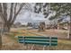 Community playground with basketball court, swings, and a slide at 5995 W Hampden Ave # 8C, Denver, CO 80227