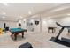 Spacious basement with a pool table, foosball table, and exercise equipment at 3762 White Rose Loop, Castle Rock, CO 80108