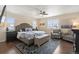 This bedroom features a ceiling fan, neutral walls, and a patterned area rug at 3762 White Rose Loop, Castle Rock, CO 80108