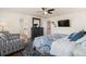 This is a bedroom with hardwood floors, ceiling fan and an accent wall decor at 3762 White Rose Loop, Castle Rock, CO 80108