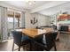 Cozy dining area with a sliding glass door and view to the living room with a fireplace at 3762 White Rose Loop, Castle Rock, CO 80108