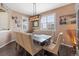 Elegant dining room featuring a modern chandelier, window shutters, and tasteful decor at 3762 White Rose Loop, Castle Rock, CO 80108