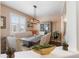 Stylish dining room with a long table, comfortable seating, and modern light fixture at 3762 White Rose Loop, Castle Rock, CO 80108