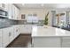 Modern kitchen with a center island, sleek appliances, and stylish backsplash, perfect for entertaining at 3762 White Rose Loop, Castle Rock, CO 80108