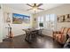 Bright office space with a ceiling fan, hardwood floors, and a mountain view at 3762 White Rose Loop, Castle Rock, CO 80108