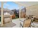 Open patio with a grill, a dining table with seating, and a chair with metal frame at 3762 White Rose Loop, Castle Rock, CO 80108