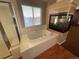 Relaxing bathroom with soaking tub, fireplace, and shower at 14010 Shannon Dr, Broomfield, CO 80023