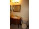 Bathroom featuring sink, decorative vanity, toilet, lighting and mirror at 720 16Th St # 513, Denver, CO 80202