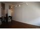 Open living area with hardwood floors and track lighting at 720 16Th St # 513, Denver, CO 80202