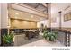 View of the lobby with seating, a reception desk and nice plants at 720 16Th St # 513, Denver, CO 80202